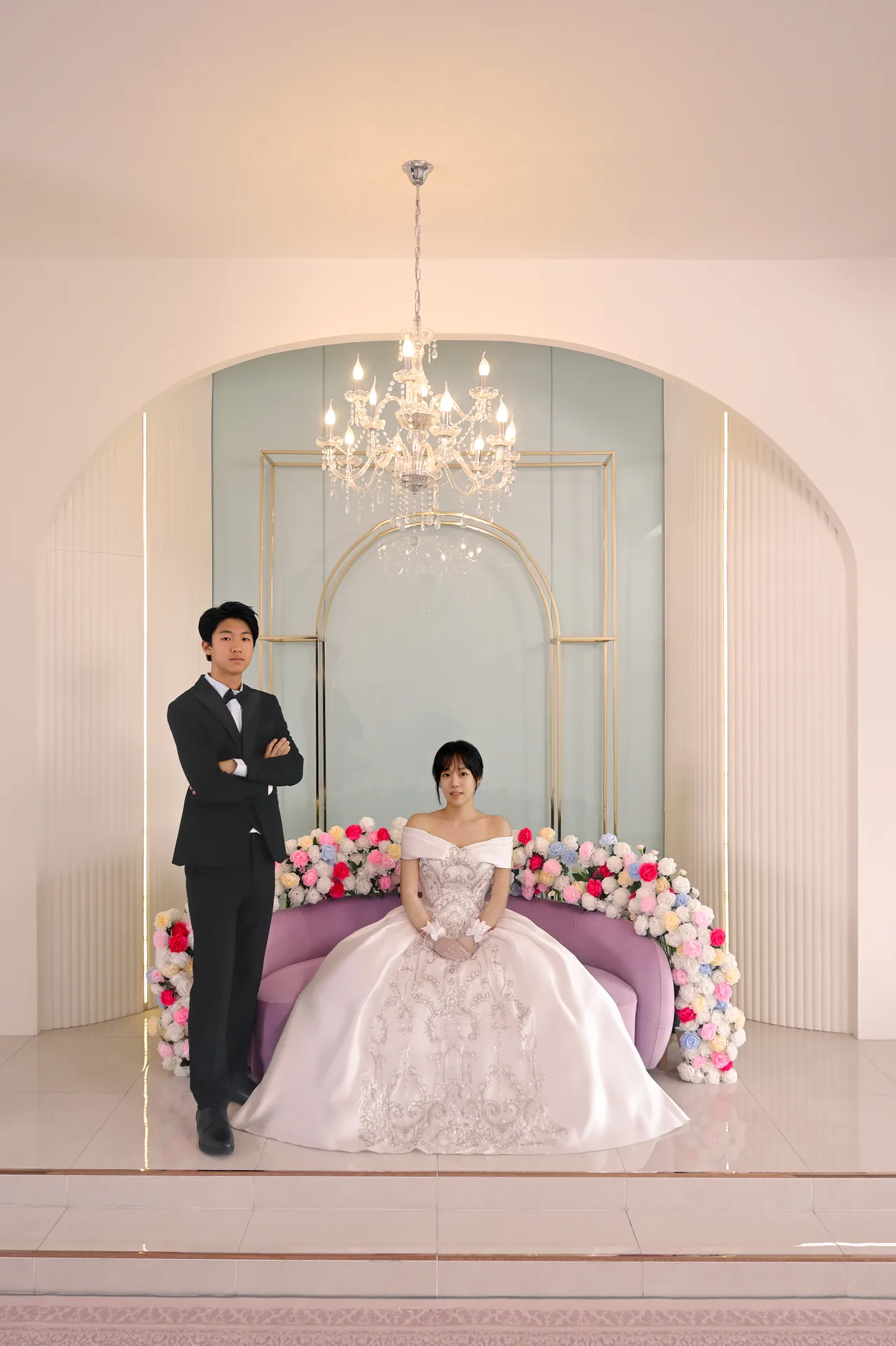 Wedding couple in a bright Korean-style studio set
