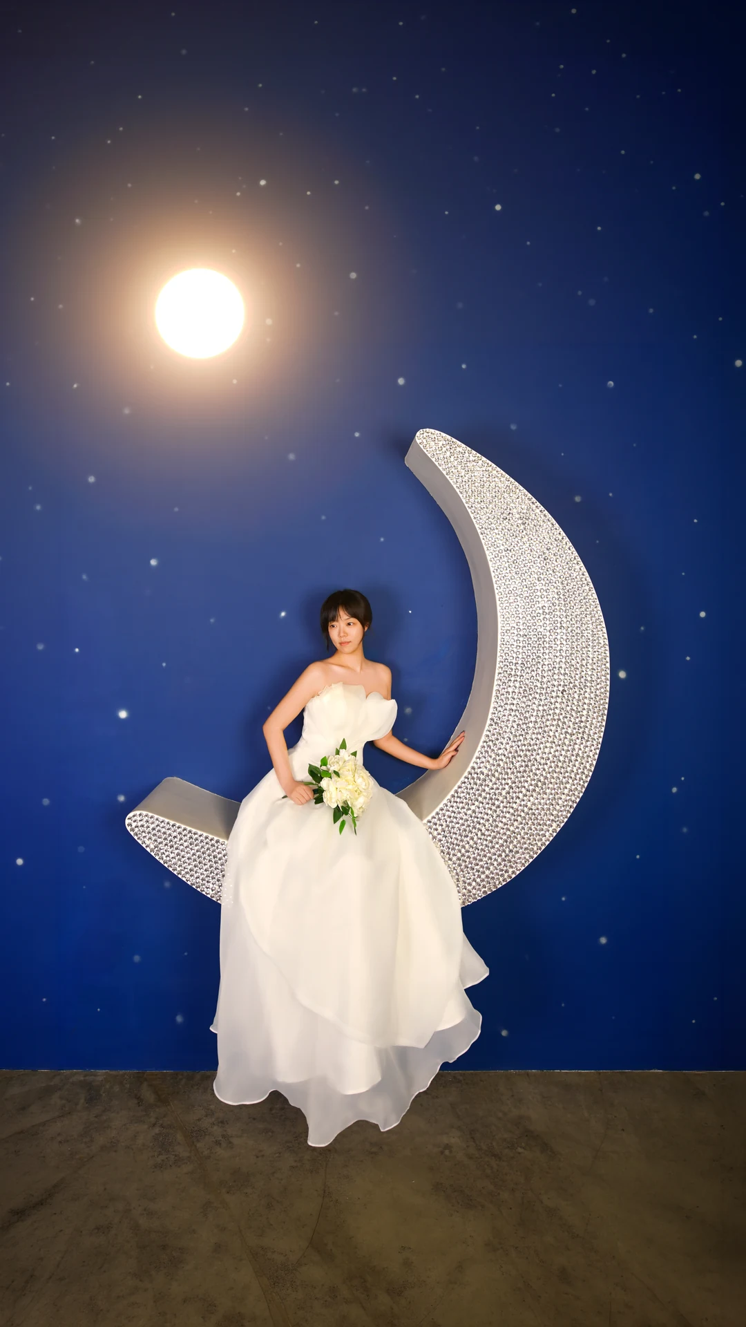 Bride posing in a moonlight wedding set